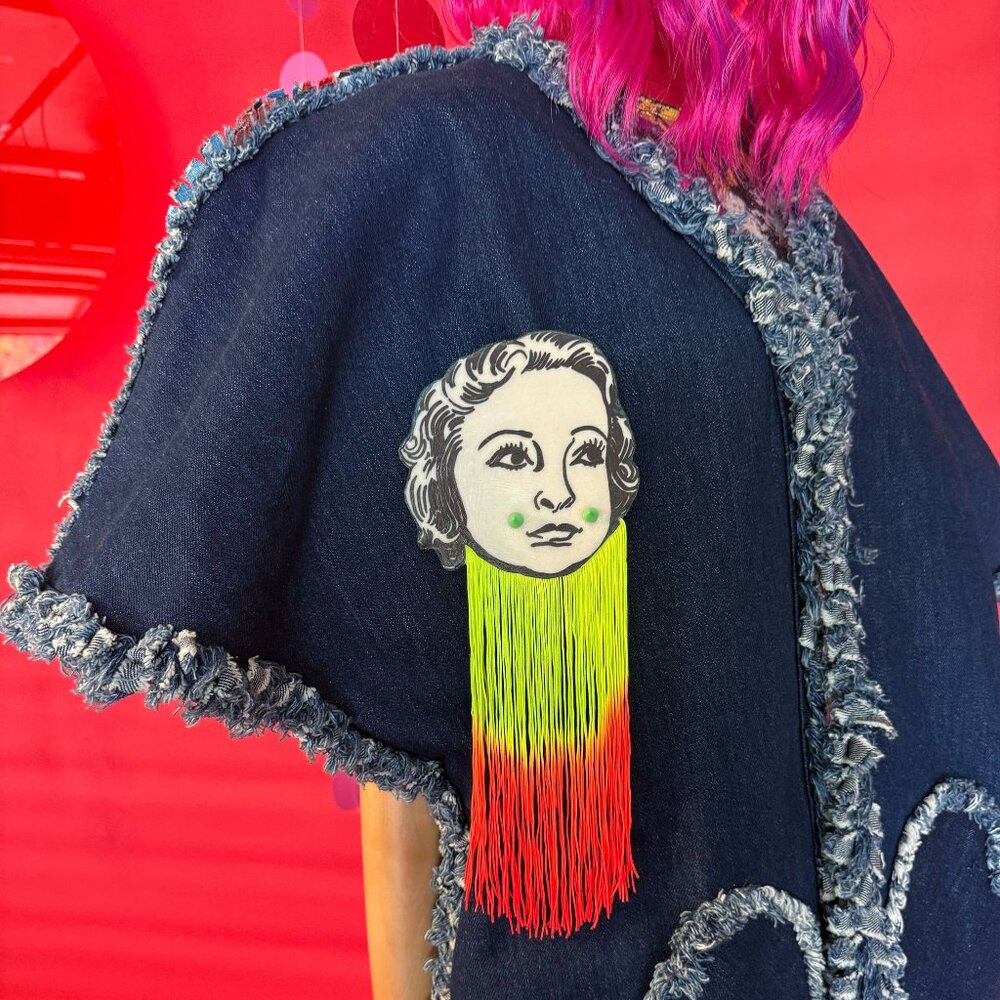 Surreal Face Fringe Brooch – Upcycled 11" Handmade Pin with Neon Tassels